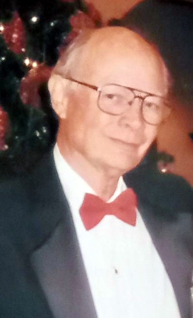 Avis de décès de John E. Woosley