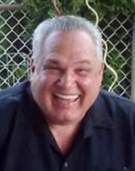 Obituary of Dennis C. Rhodes