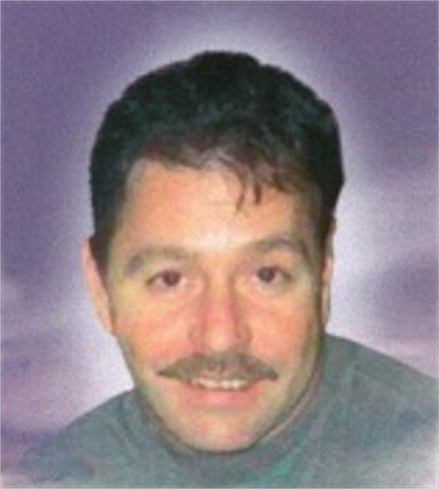 Obituary of M. Guy Ouellette