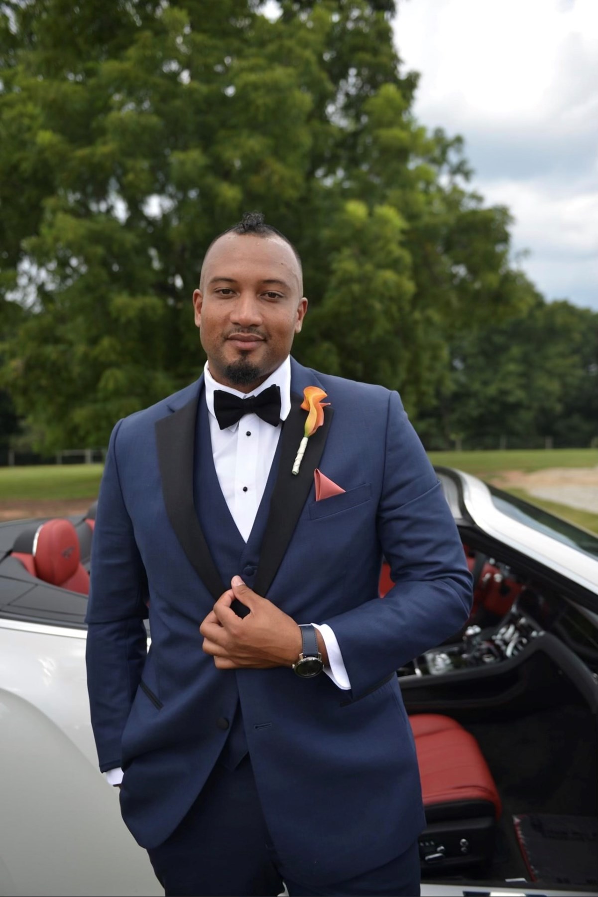 Navy blue tuxedo deals with red bow tie